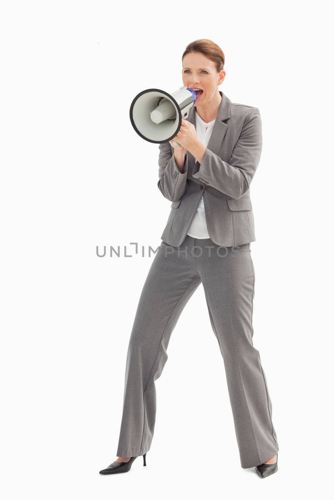 A businesswoman is talking  on a megaphone
