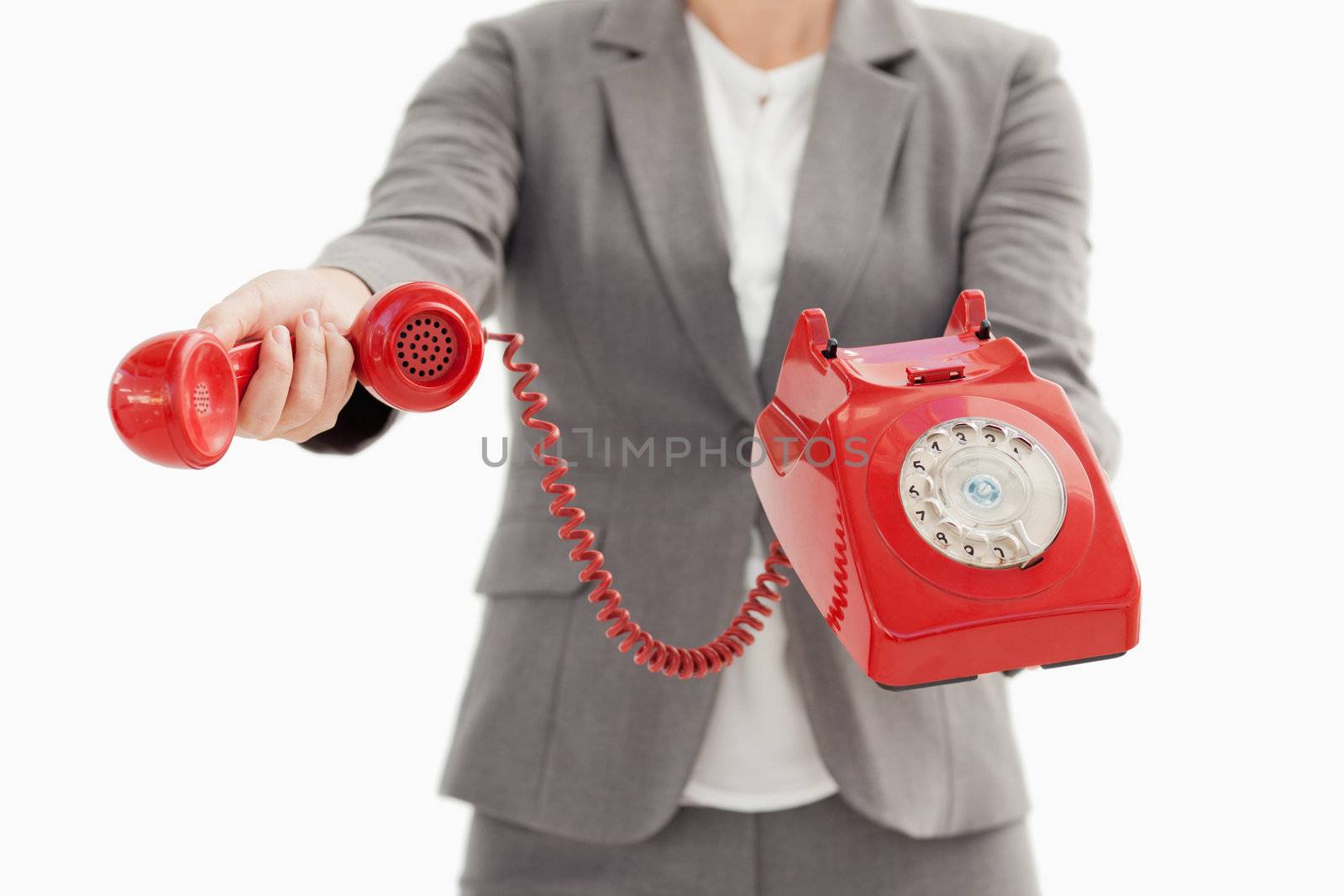A business person is holding a phone