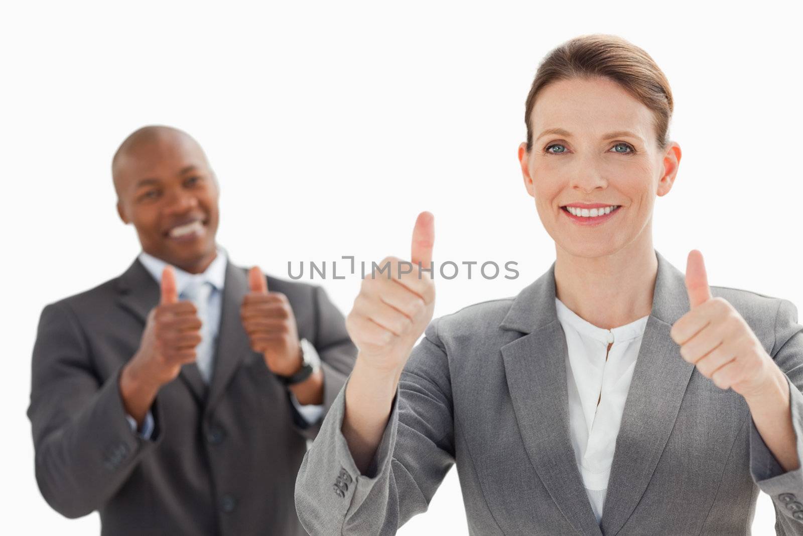 Business people are smiling with their thumbs up