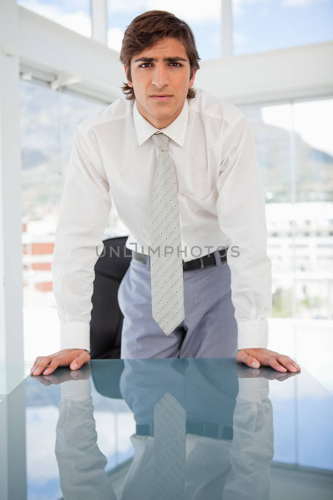 young serious businessman staring at the camera by Wavebreakmedia