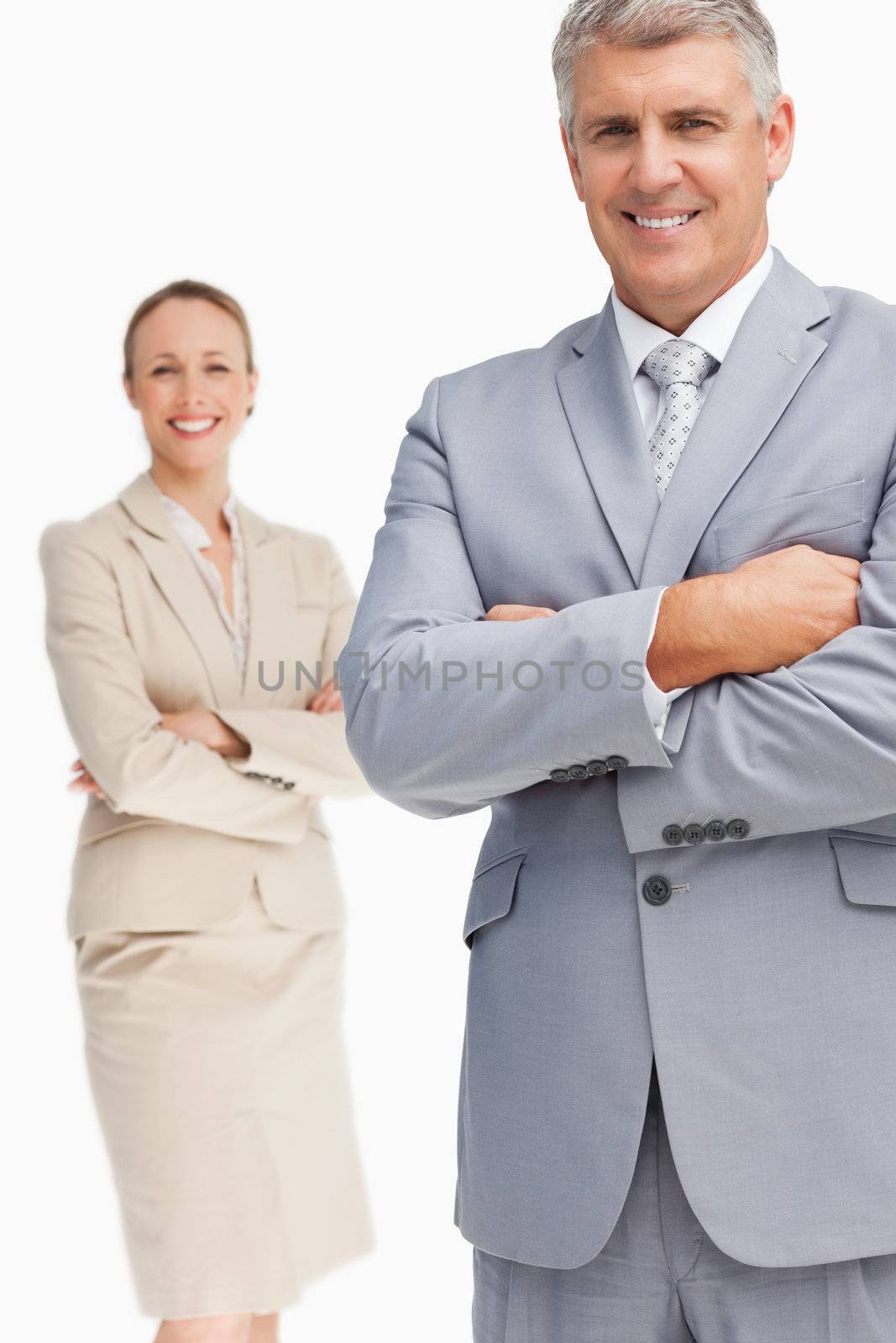 Cheerful business people with folded arms by Wavebreakmedia