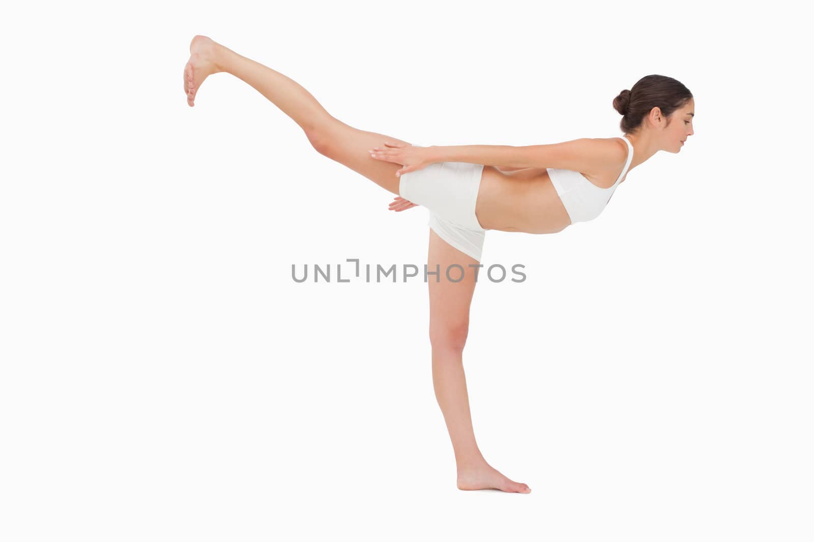 Woman in yoga position against white background