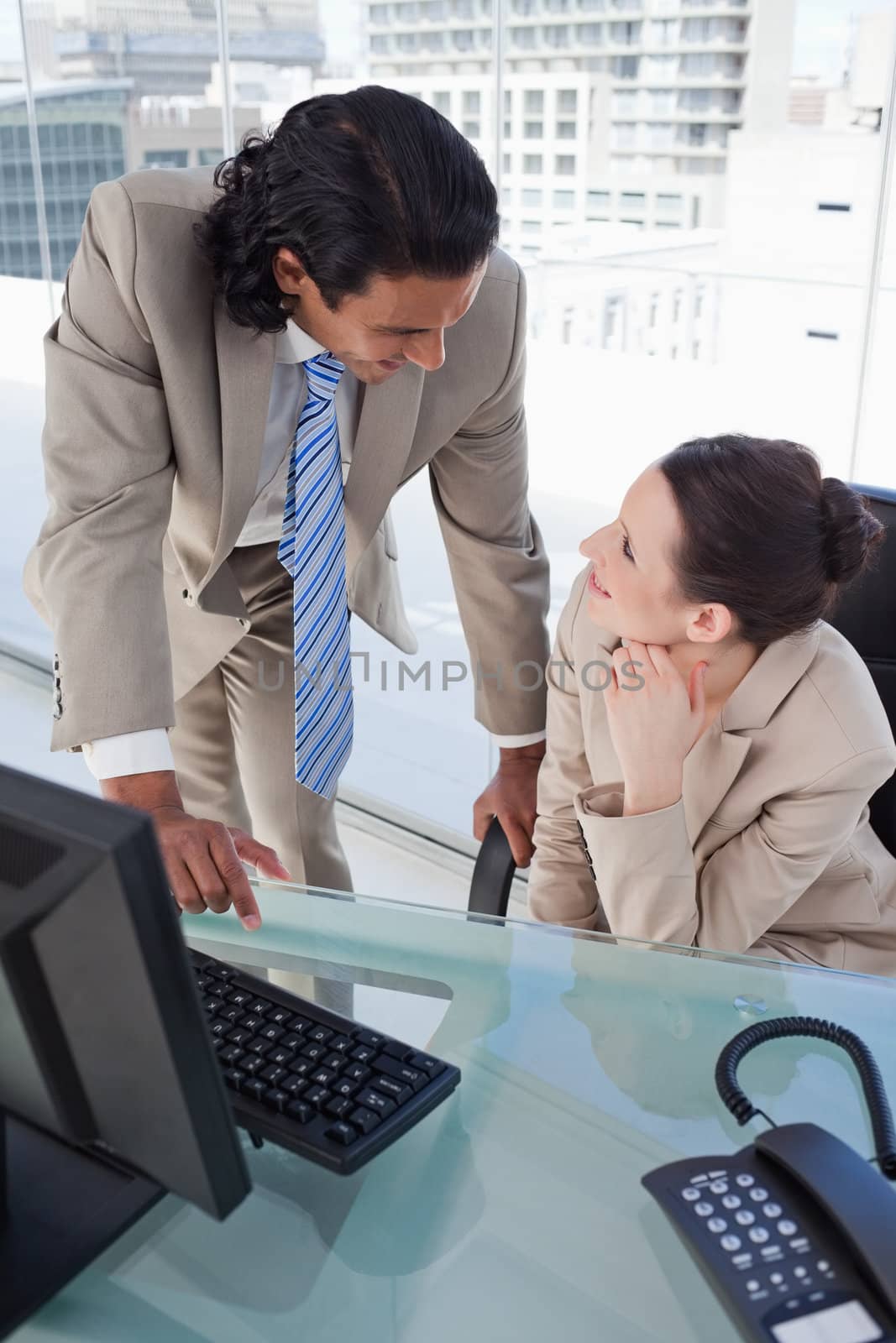 Portrait of a happy business team using a computer in an office