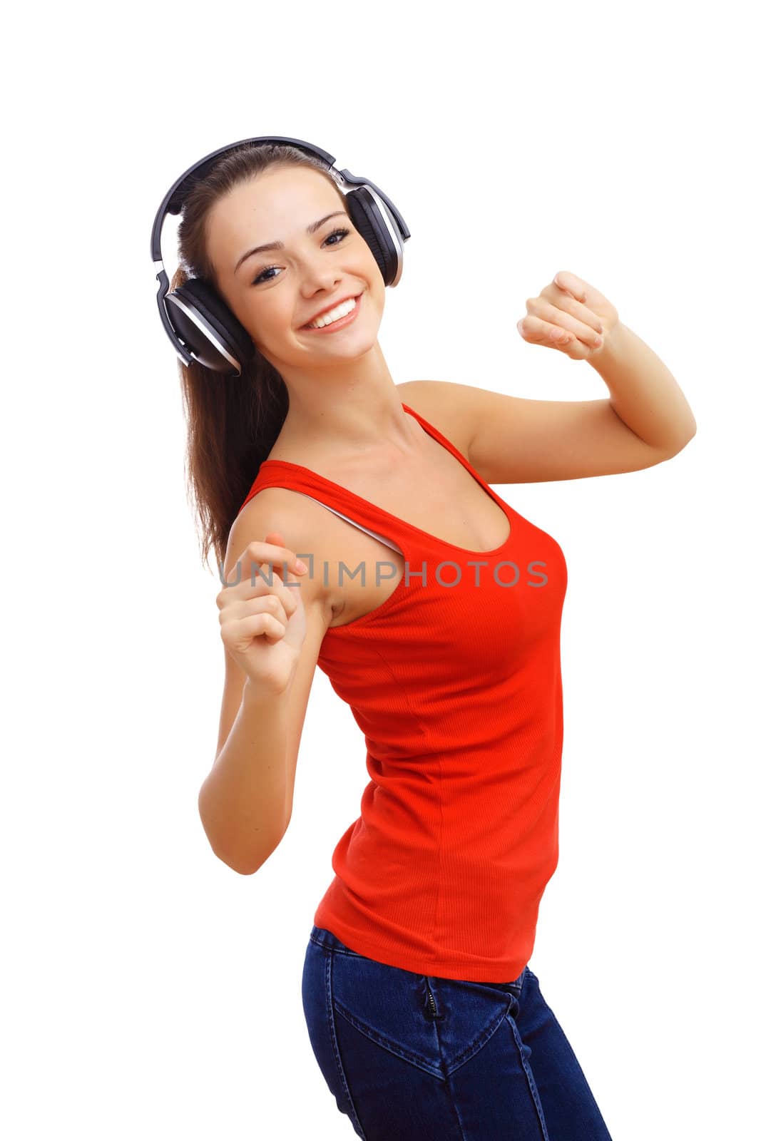 Happy smiling girl dancing and listening to music