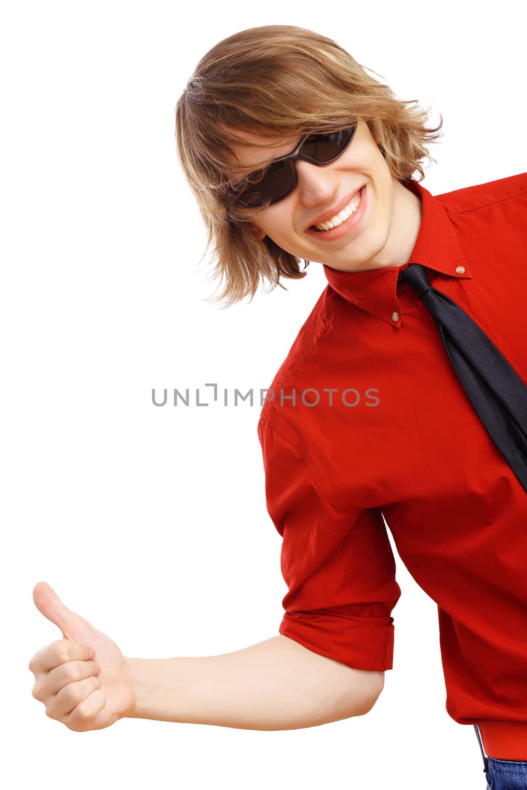 Happy smiling young man dancing and listening to music