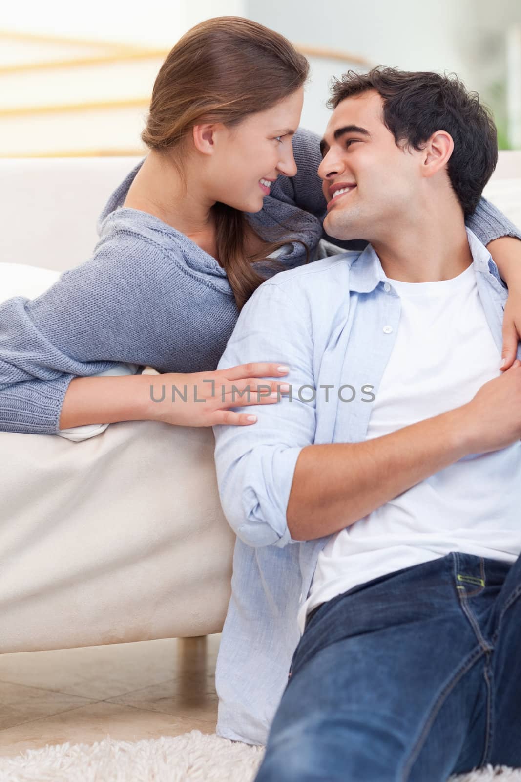 Portrait of an in love couple embracing each other in their living room