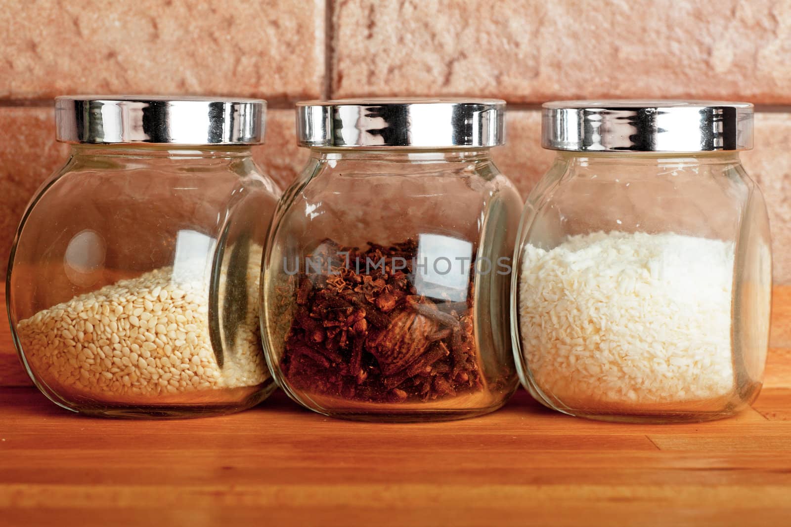 Closeup view of small glass jars with spices