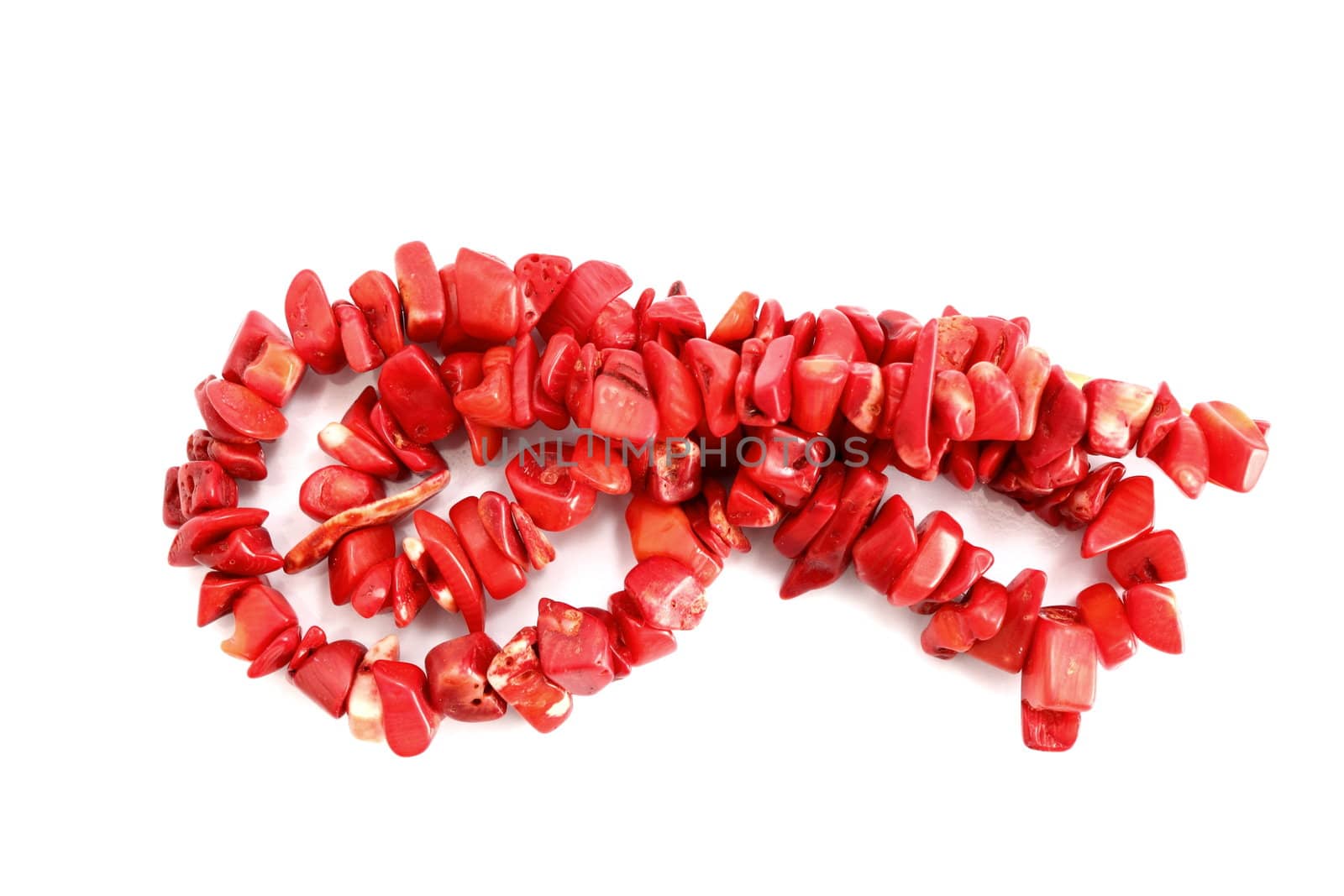 natural red coral necklace over white background