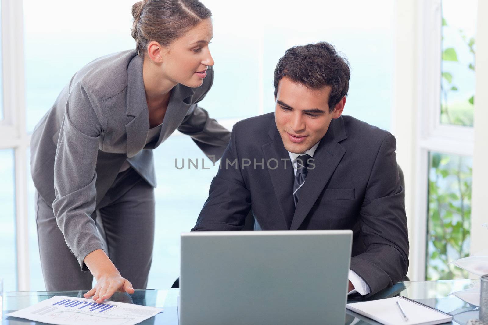 Young business team working with a laptop in an office