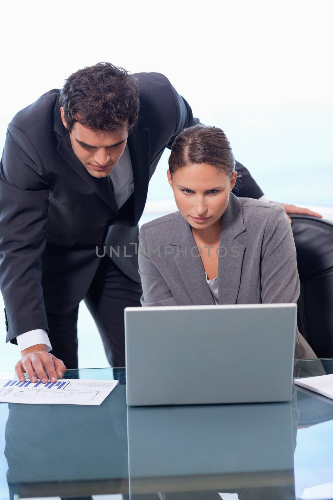 Portrait of a business team working with a laptop in an office