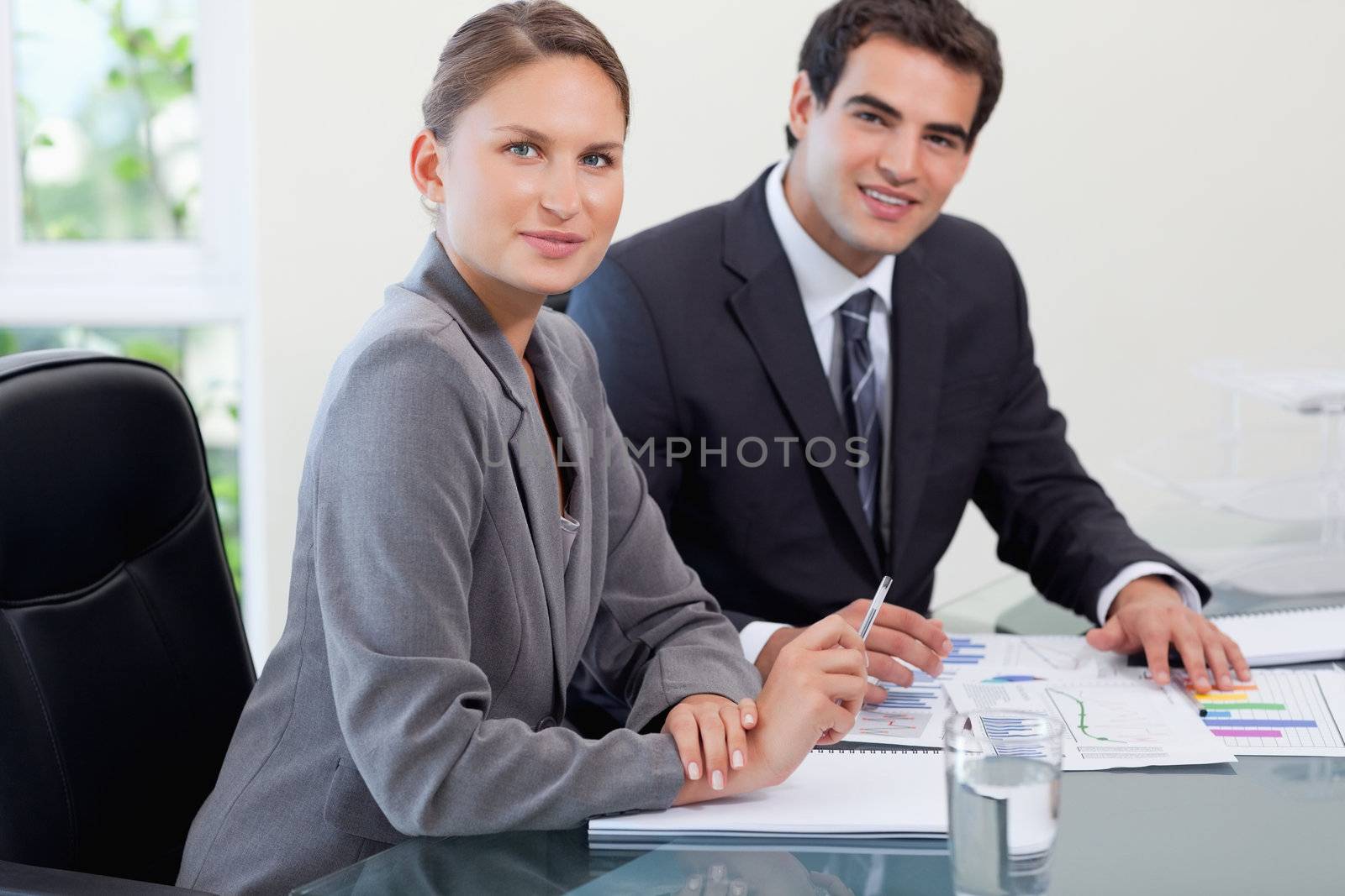 Young business team studying statistics in a meeting room