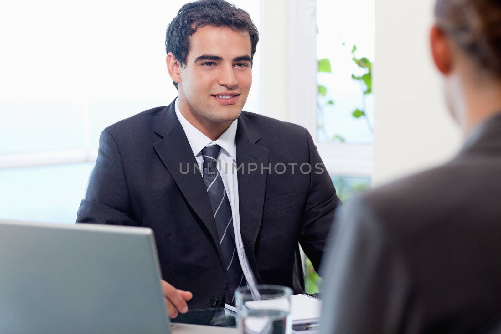 Young manager interviewing a female applicant in his office