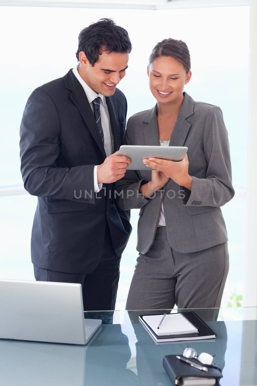 Young trades partner looking at tablet in their hands