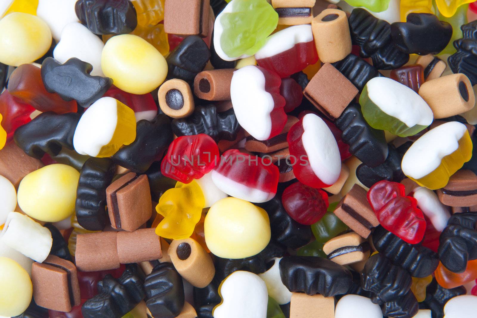 closeup of many colorful winegums isolated