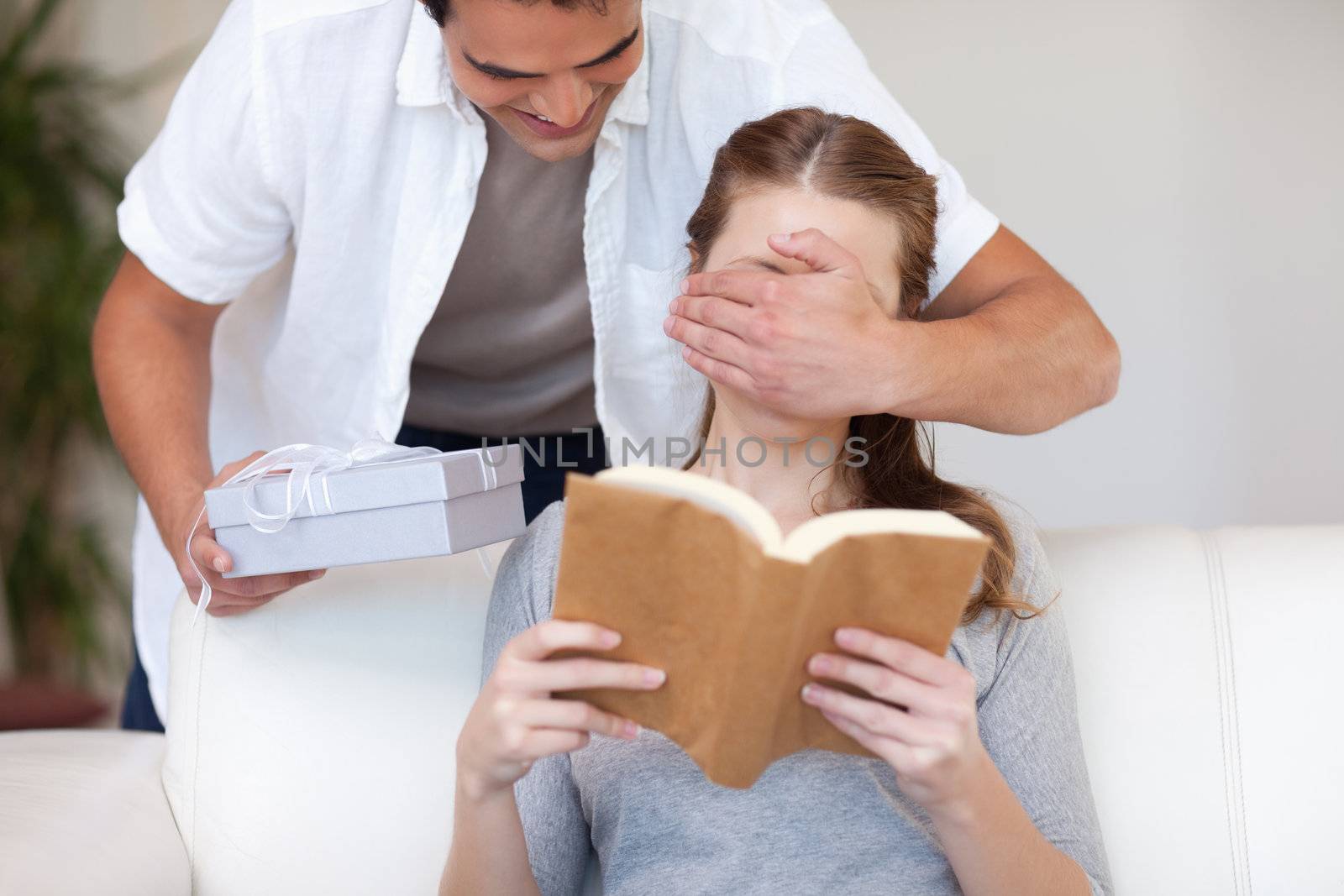 Young man having a surprise for his girlfriend