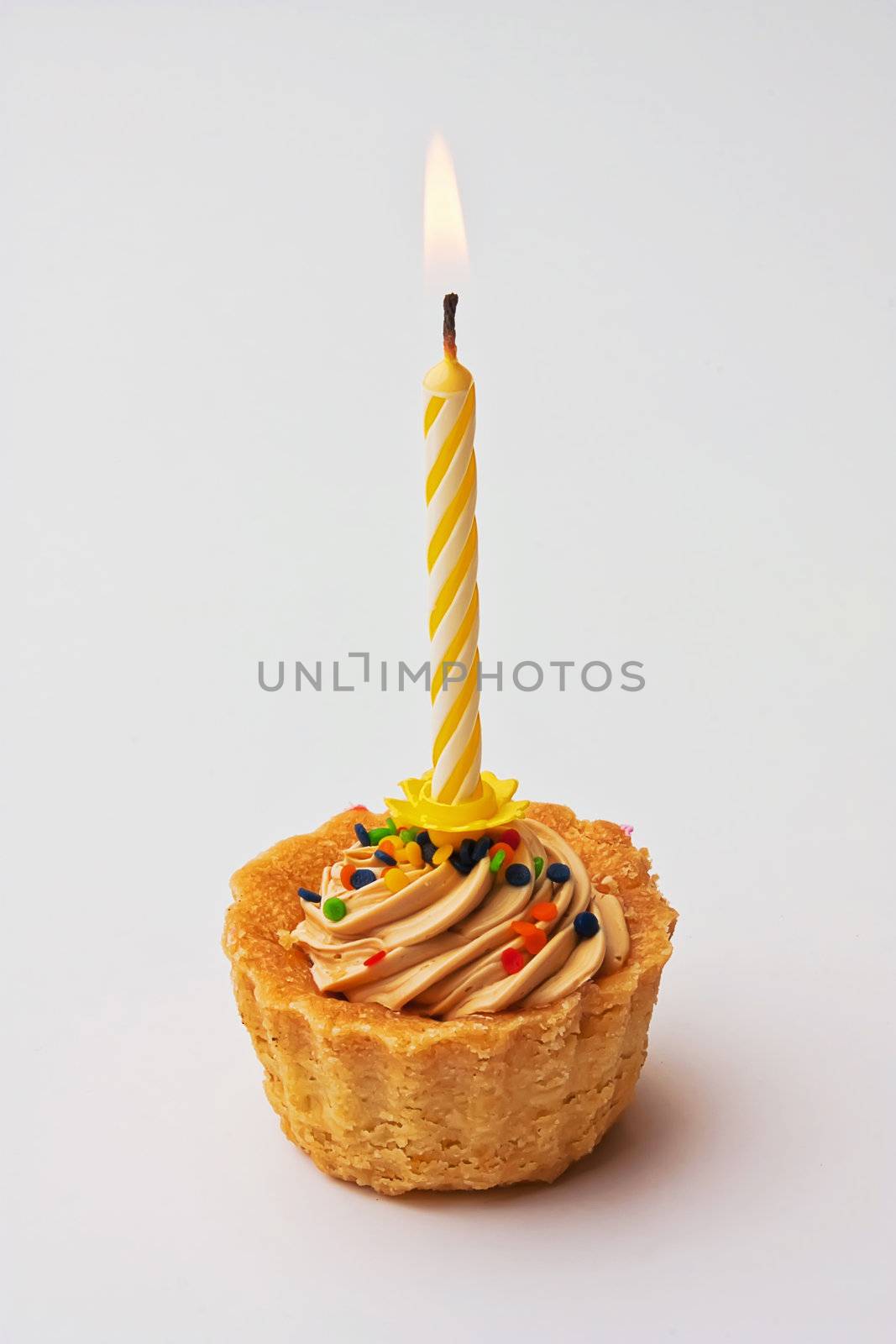 Tartlet cake with a candle