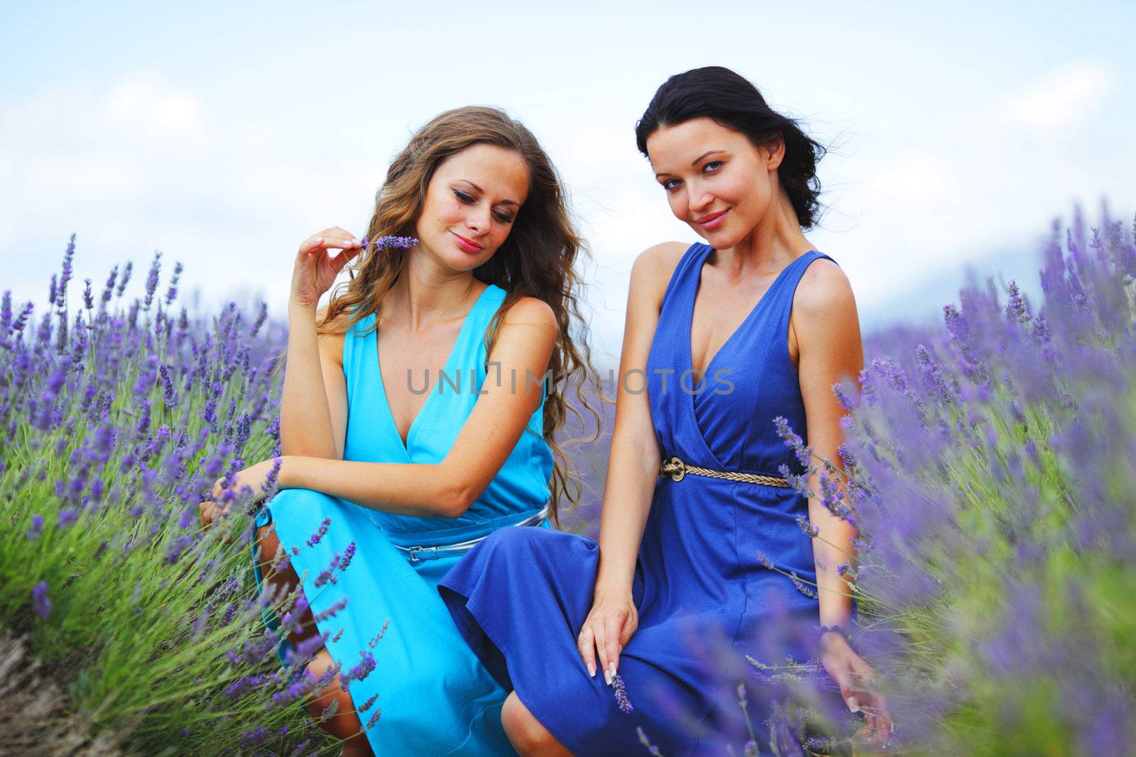 two women on lavender field by Yellowj