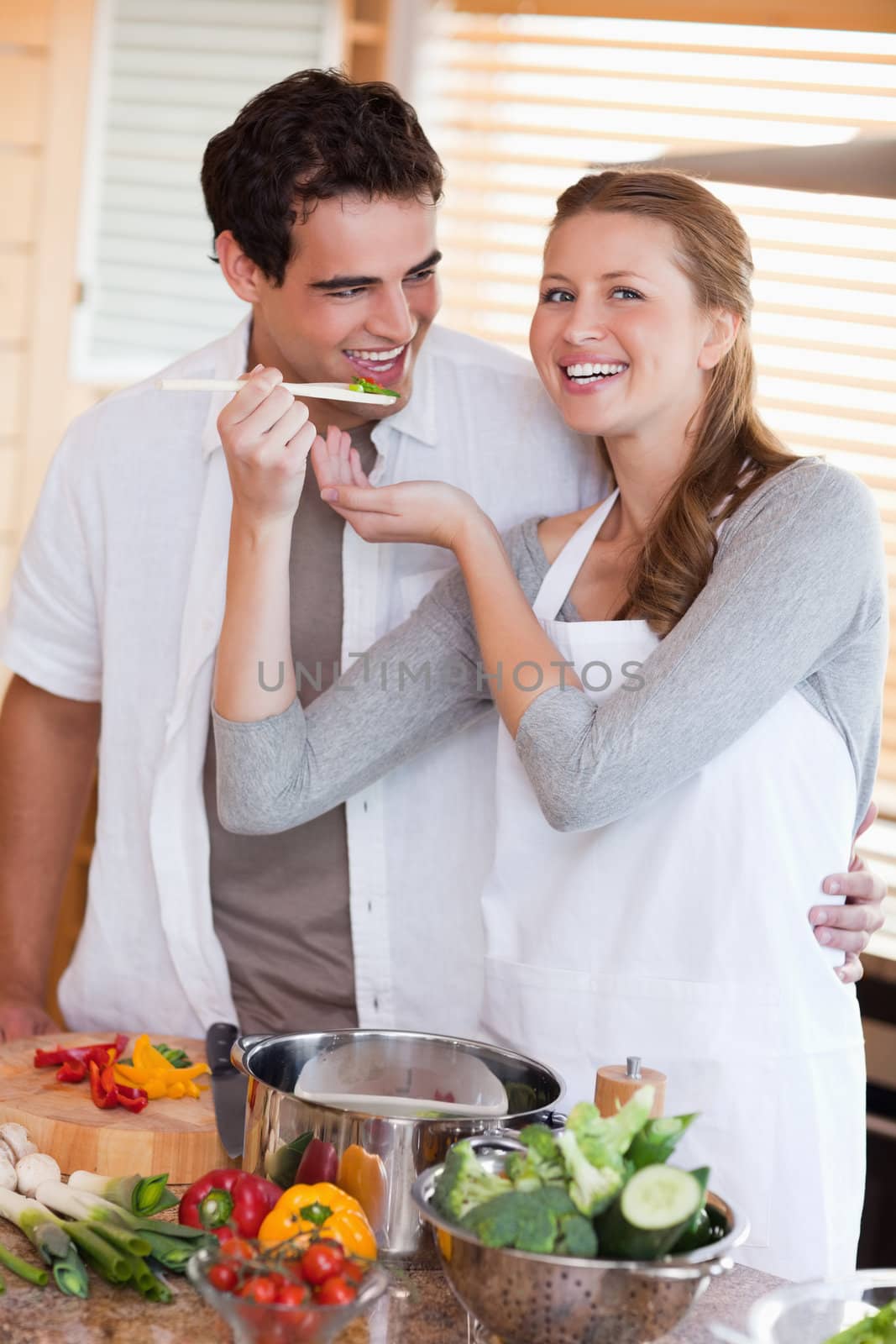 Young couple enjoys preparing dinner together