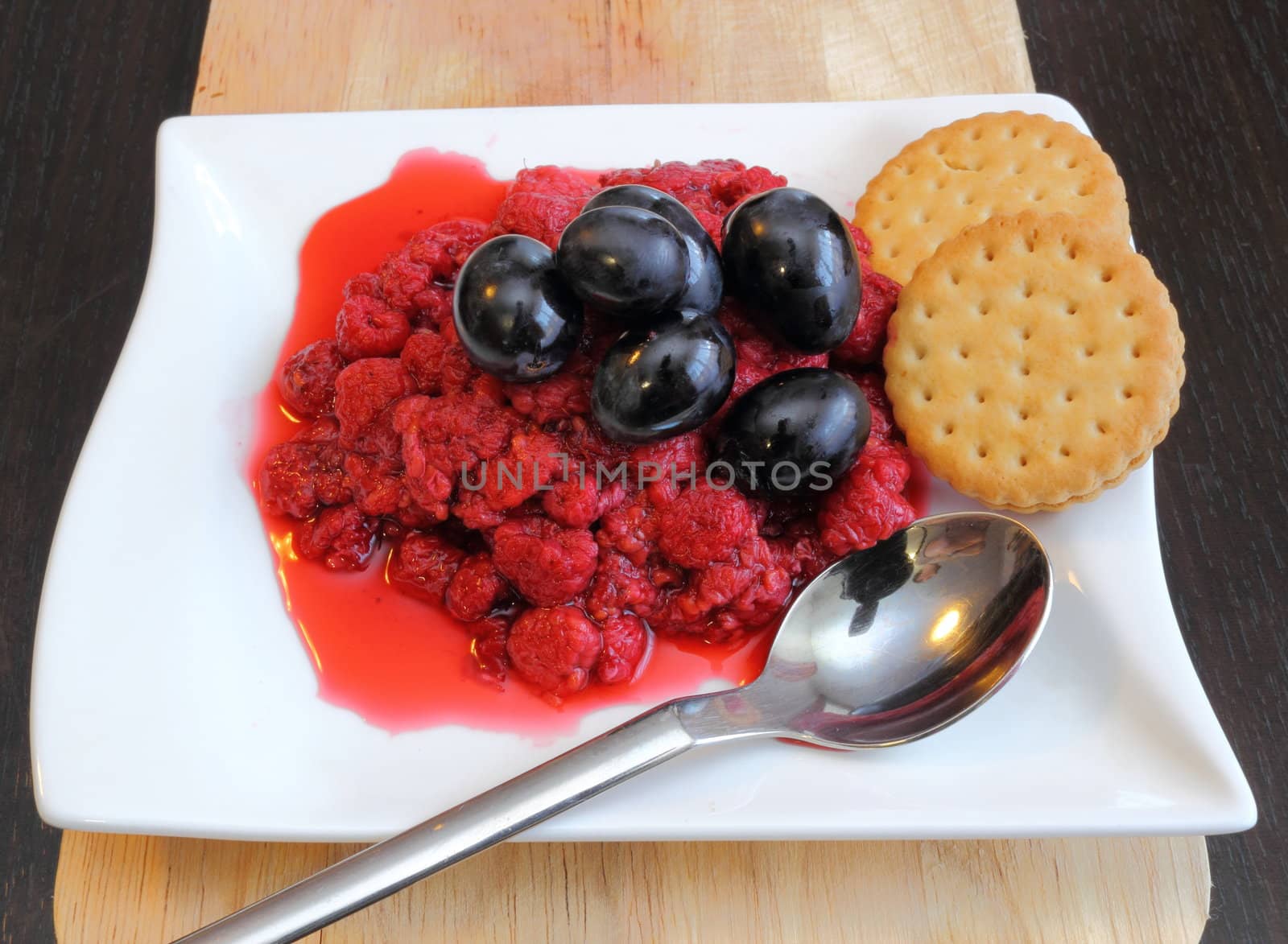 raspberry with grapes and biscuits by taviphoto