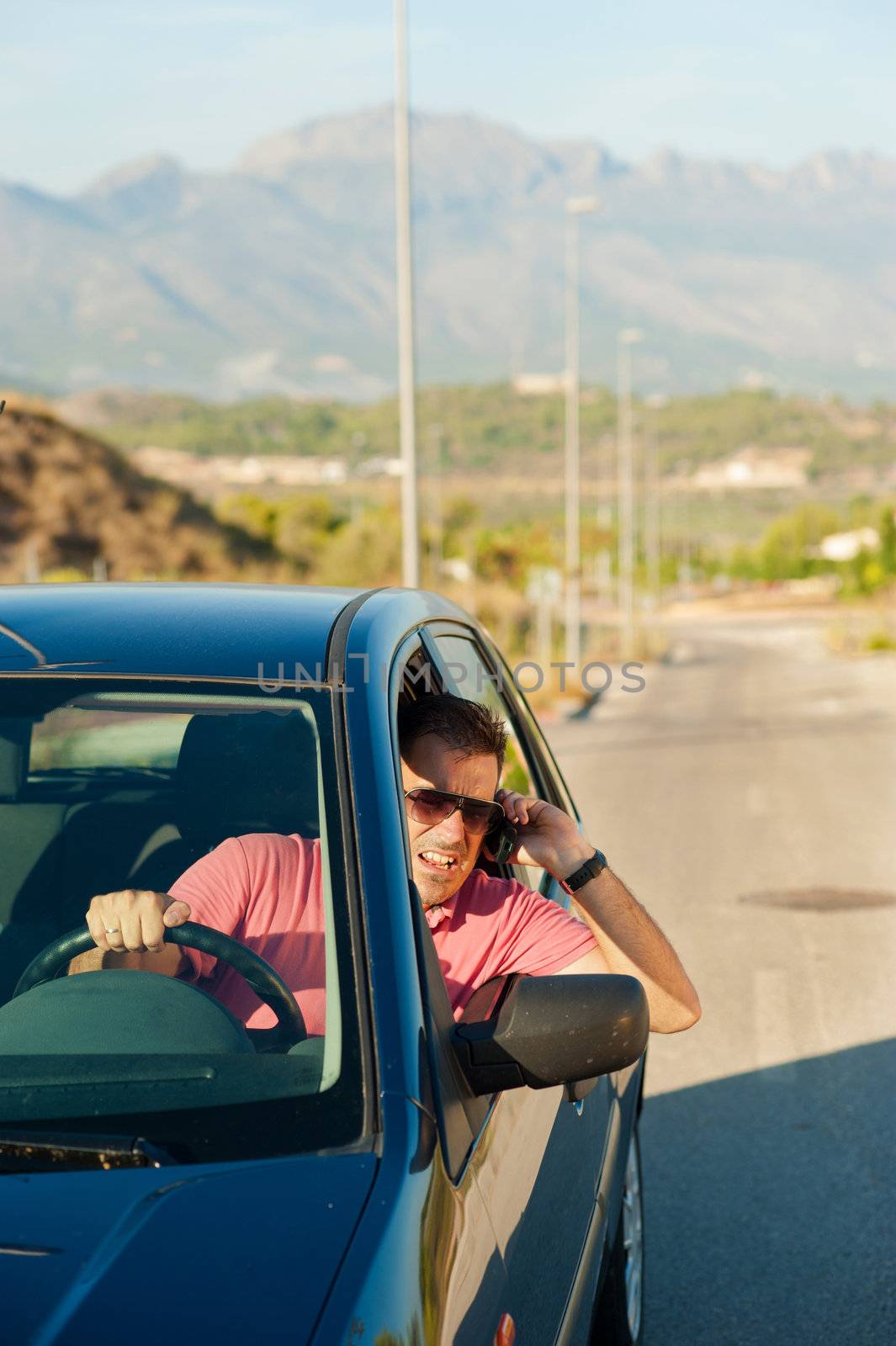 Aggressive guy yelling on the phone whiledriving