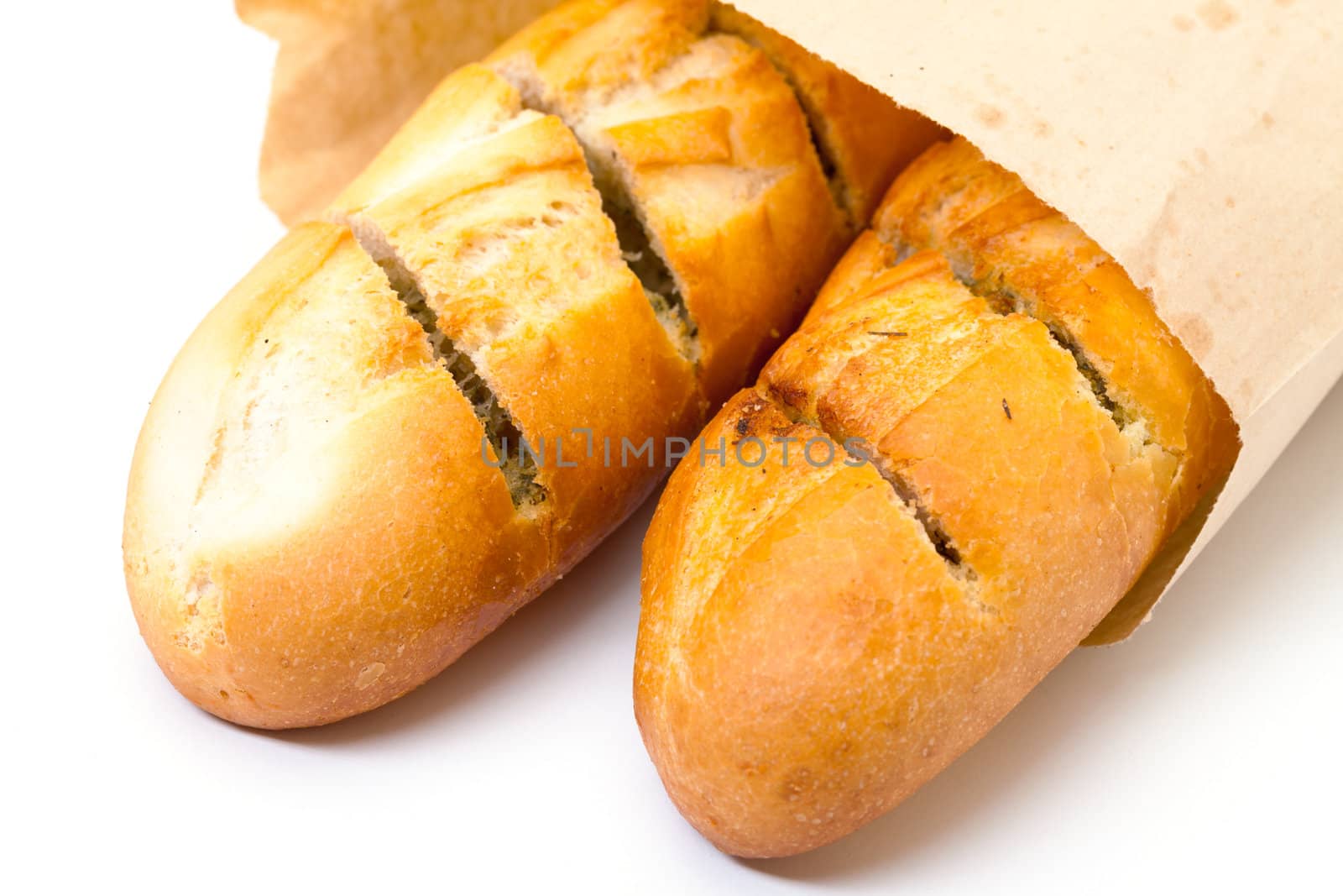 Delicious Baguette in Paper Bag, on white background