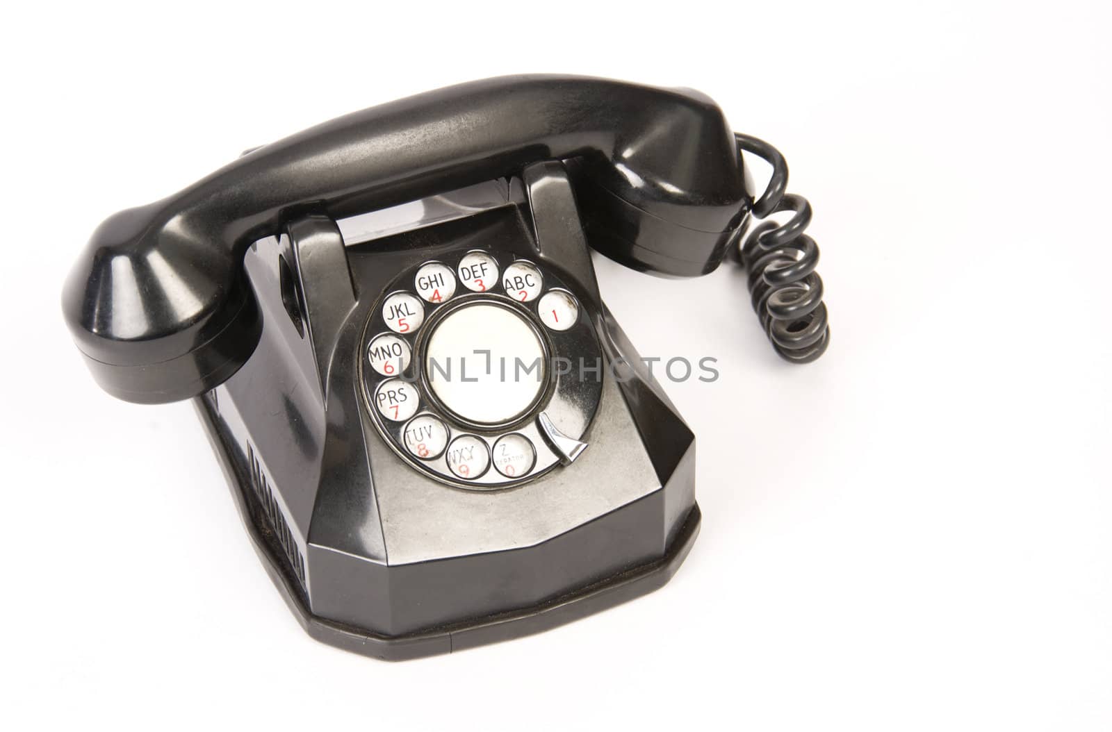 A Vintage Rotary Dial Telephone isolated on white