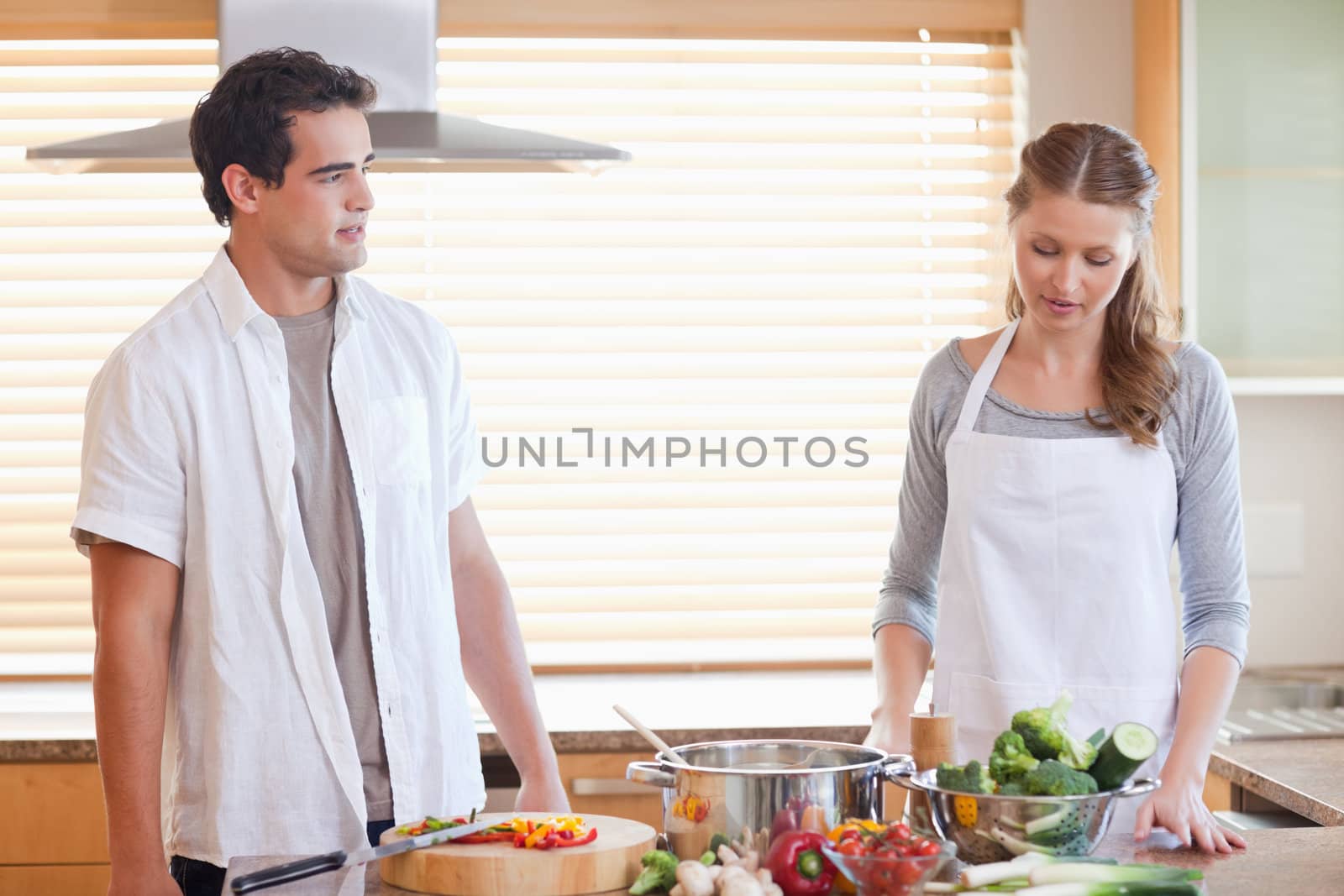 Young couple having a tensed situation in the kitchen