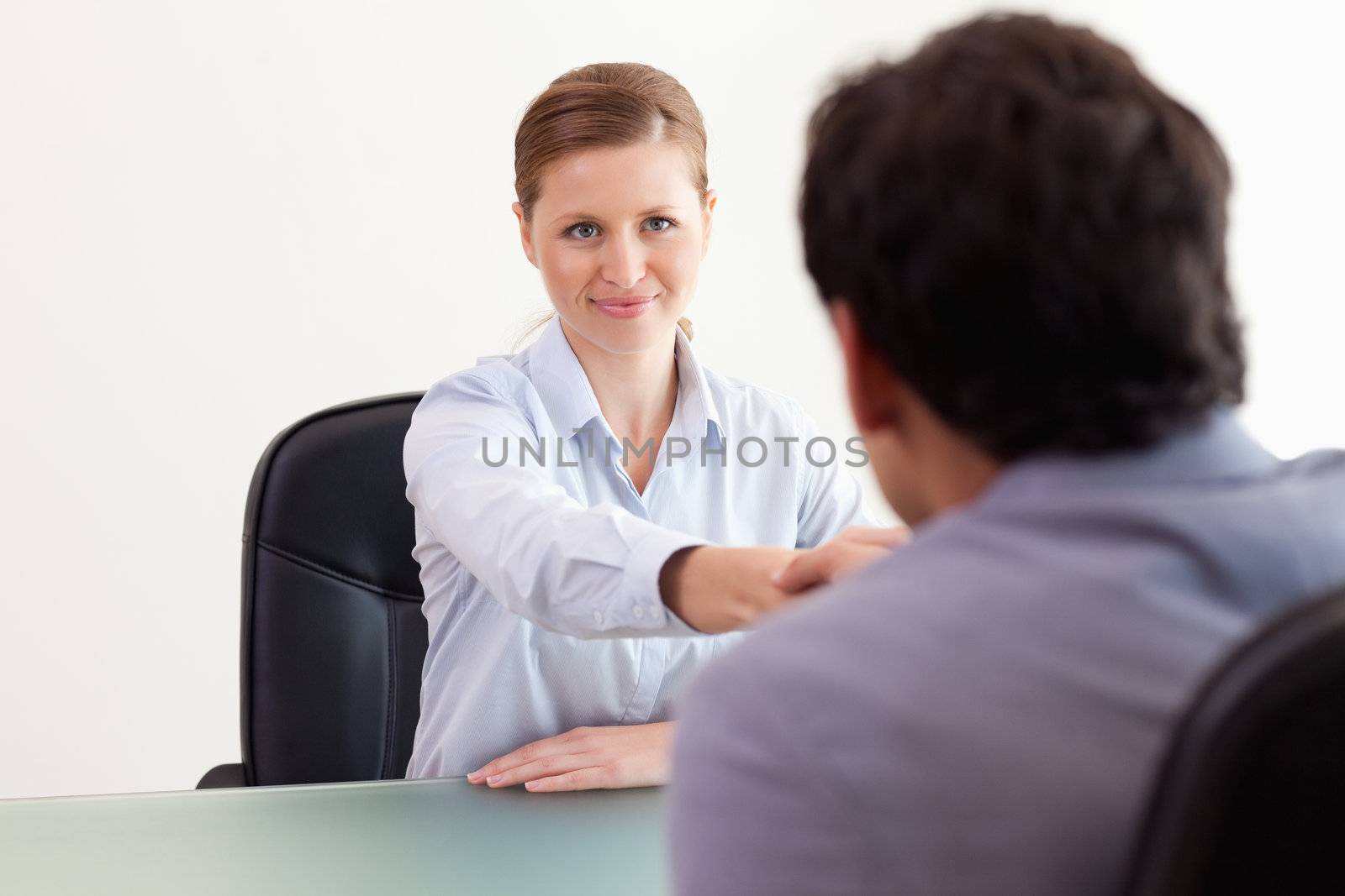 Young trading partner greeting each other