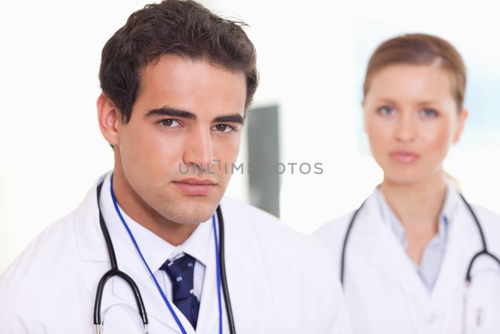 Young medical assistants standing next to each other