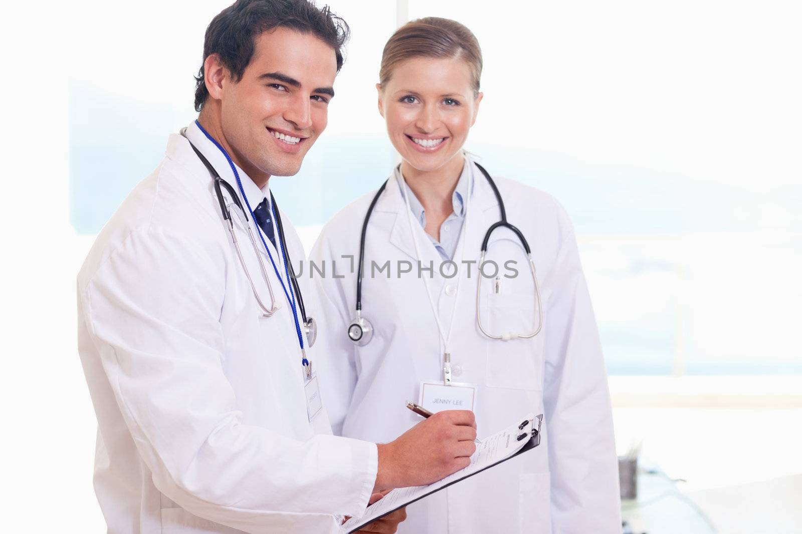 Young medical team taking notes