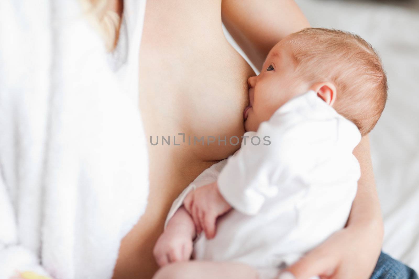 Mother suckling her small newborn