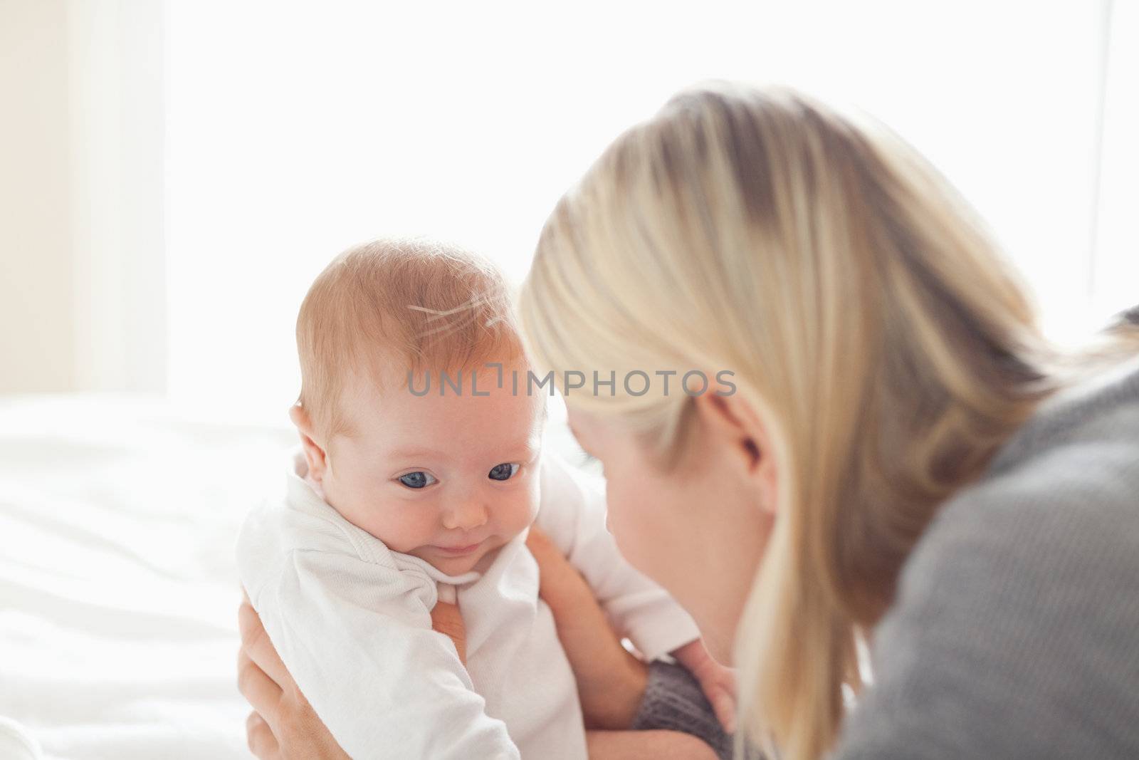 Young mother taking care of her newborn