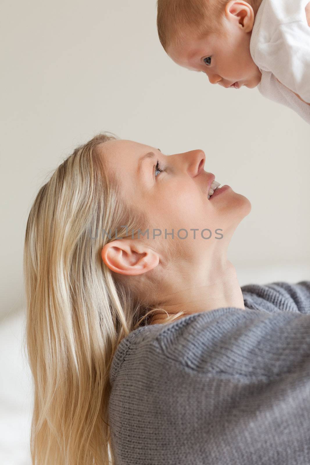 Young mother holding infant