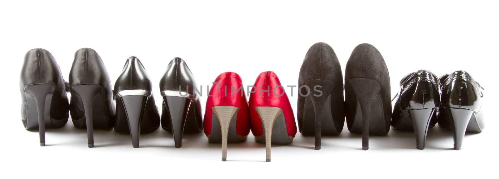 Several pairs of high heels in red and black