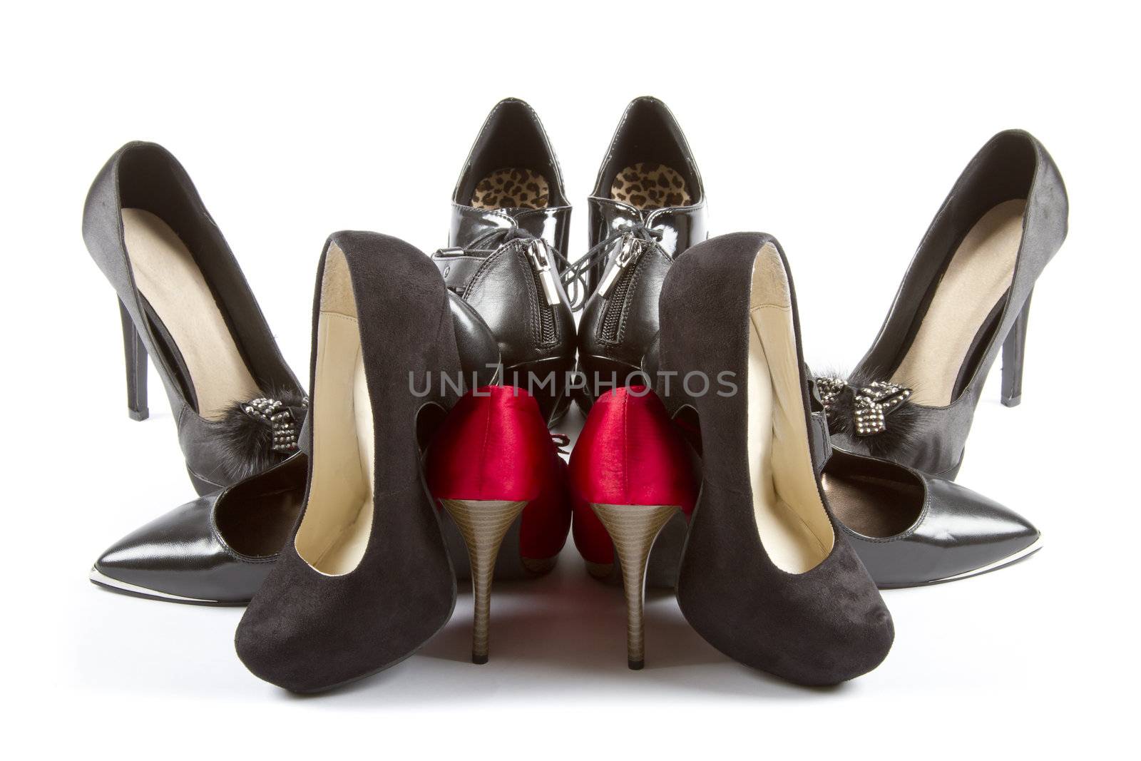 Several pairs of high heels in red and black