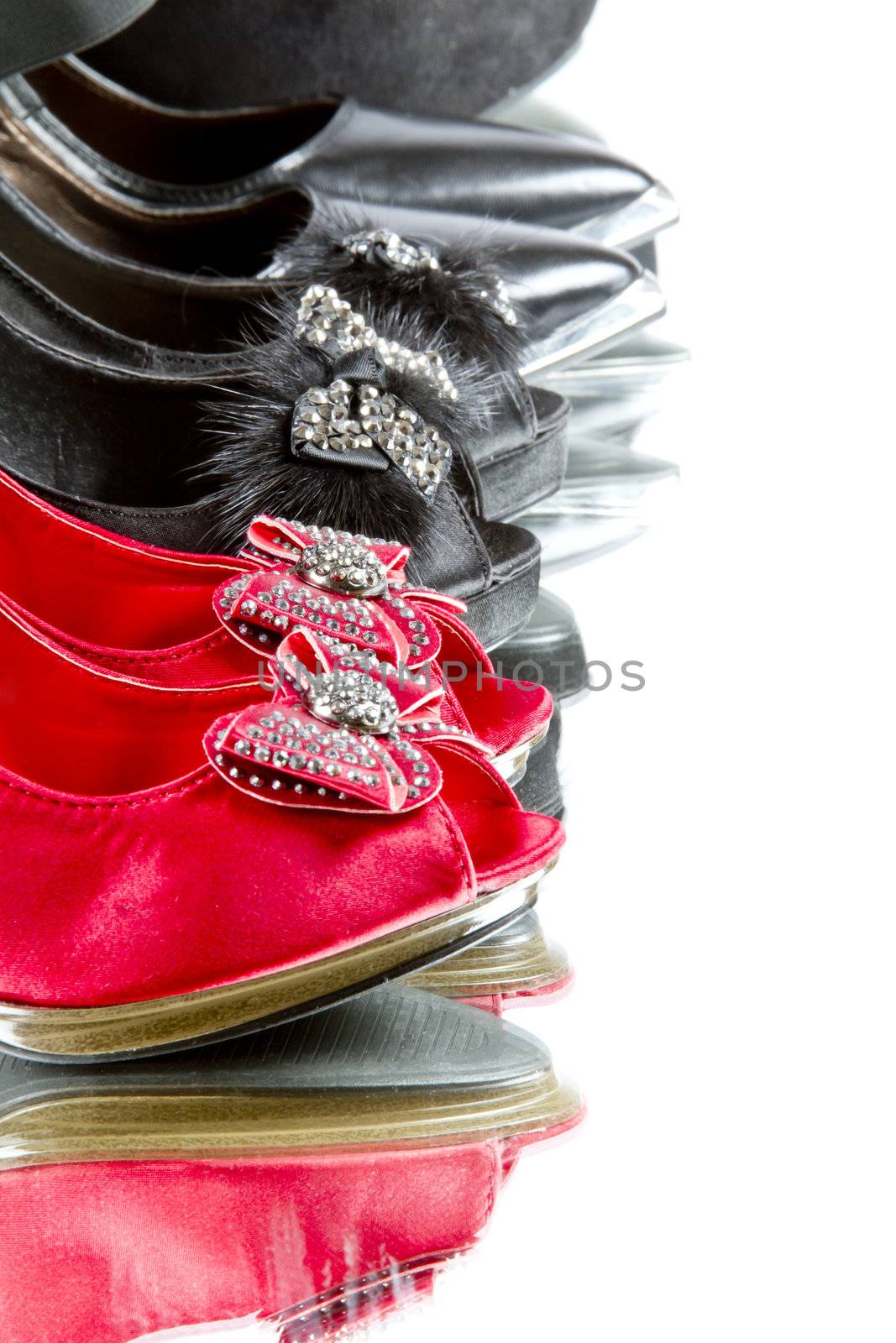 Several pairs of high heels in red and black