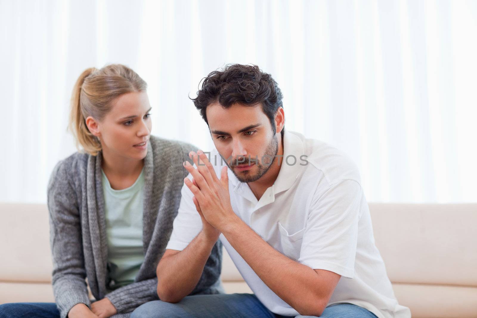 Man being mad at his girlfriend in their living