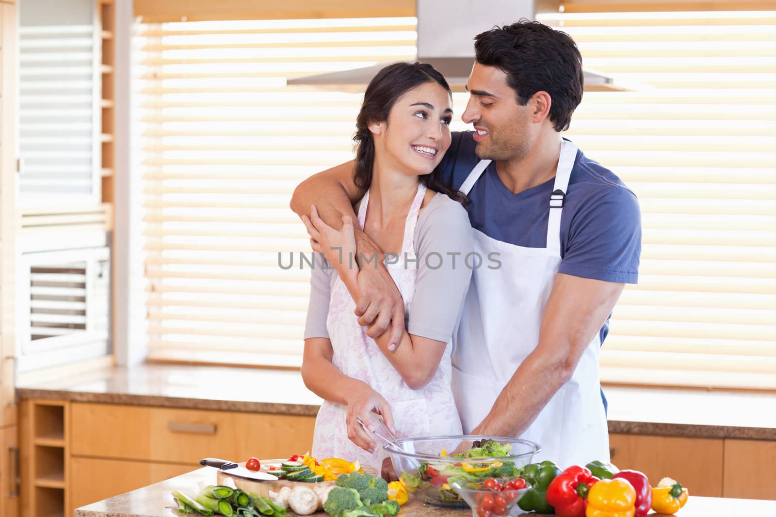Lovely young couple posing in their kitchen