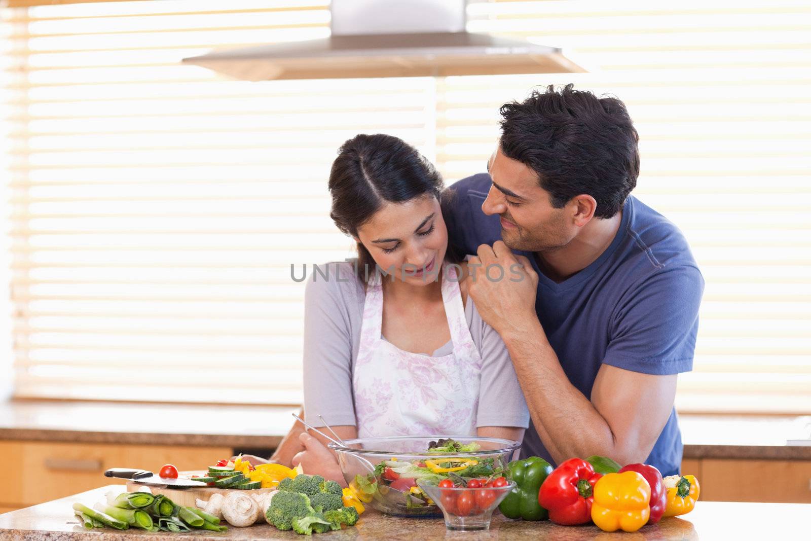 In love couple posing in their kitchen