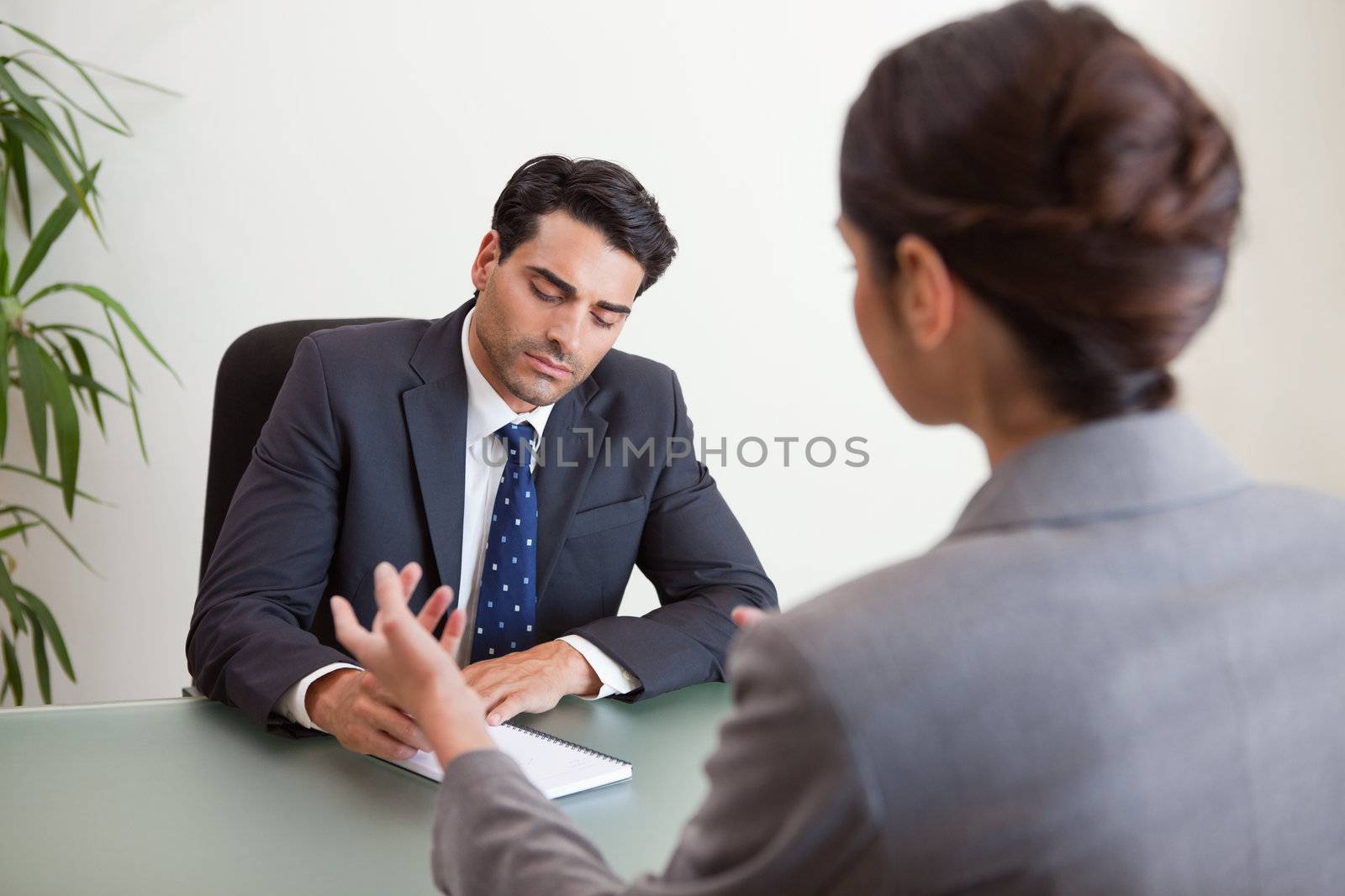 Focused marketers having a brainstorming in a meeting room