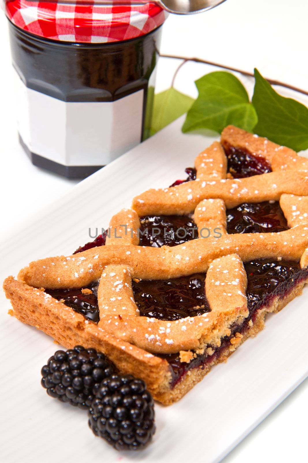 blackberry tarte on white background