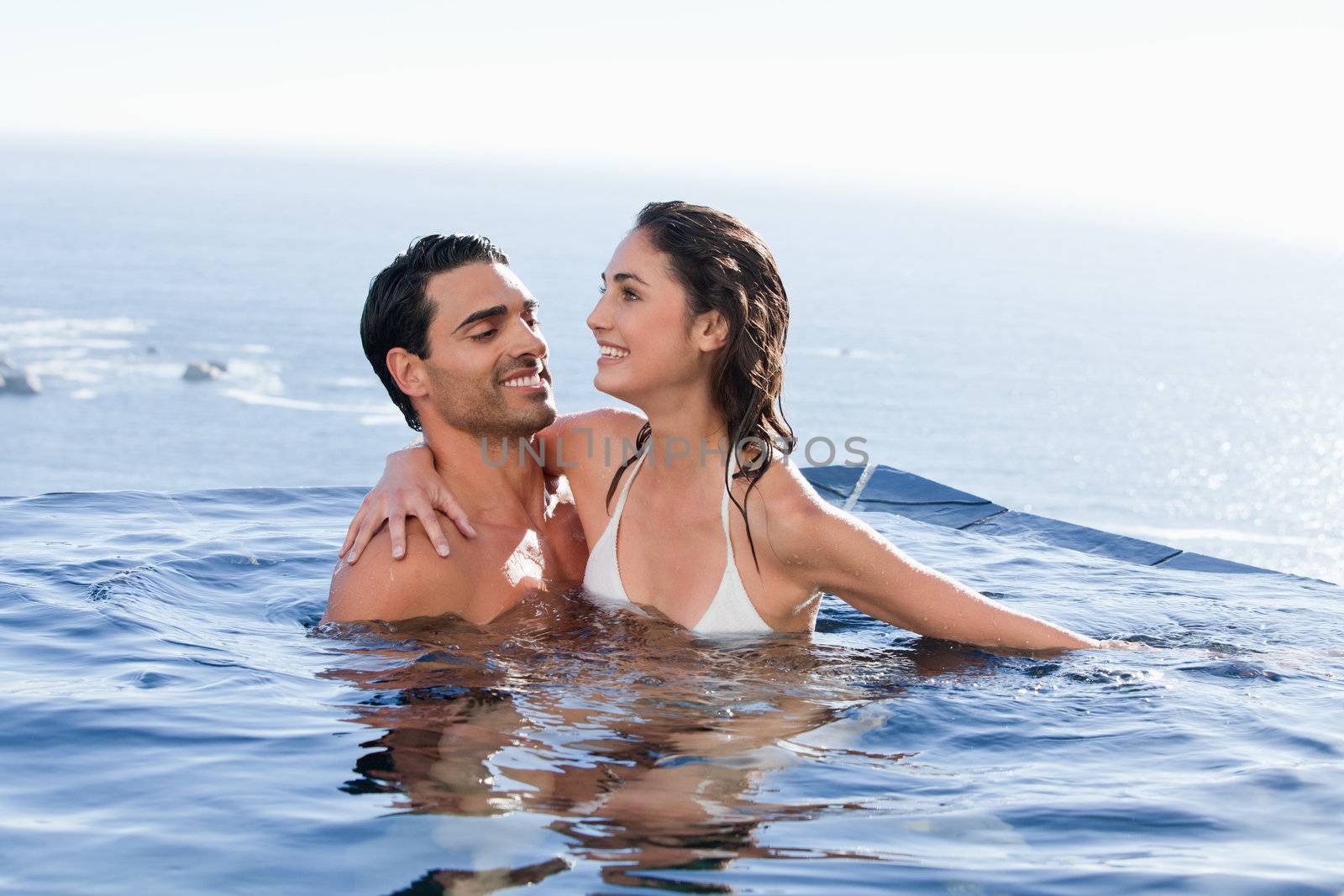 Couple playing together in a swimming pool