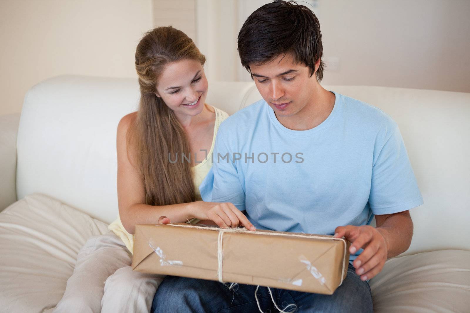 Couple looking at a package in their living room