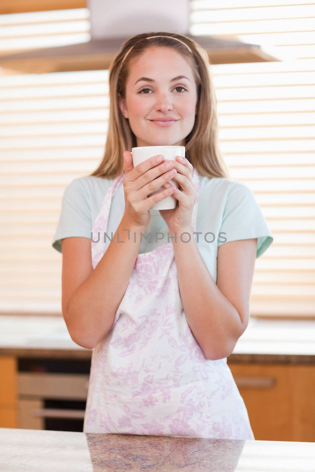 Portrait of a woman drinking a cup of tea by Wavebreakmedia
