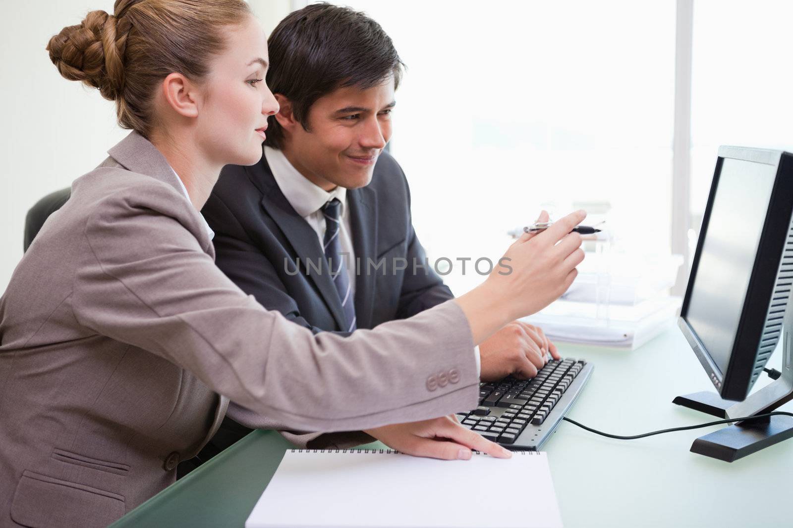 Business people working with a computer by Wavebreakmedia