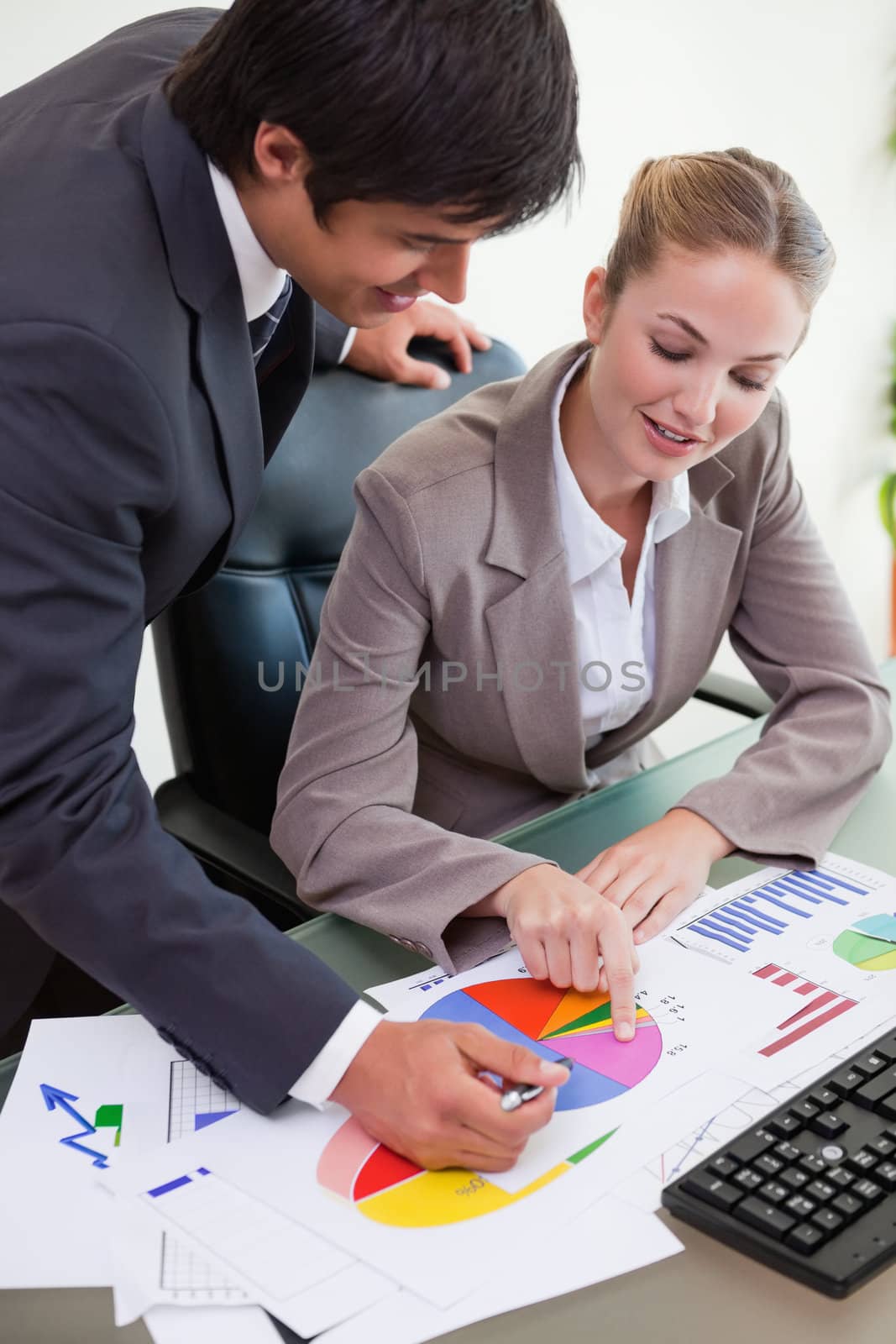 Portrait of a business team studying statistics in a meeting room