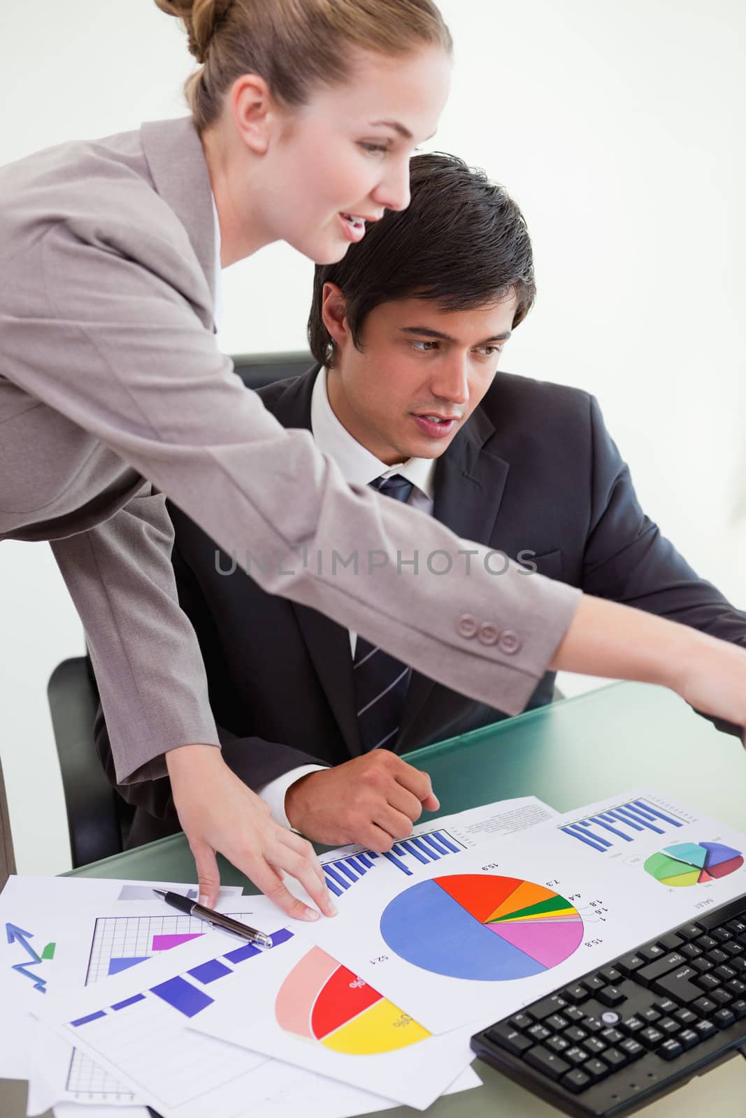 Portrait of a professional business team studying statistics in a meeting room
