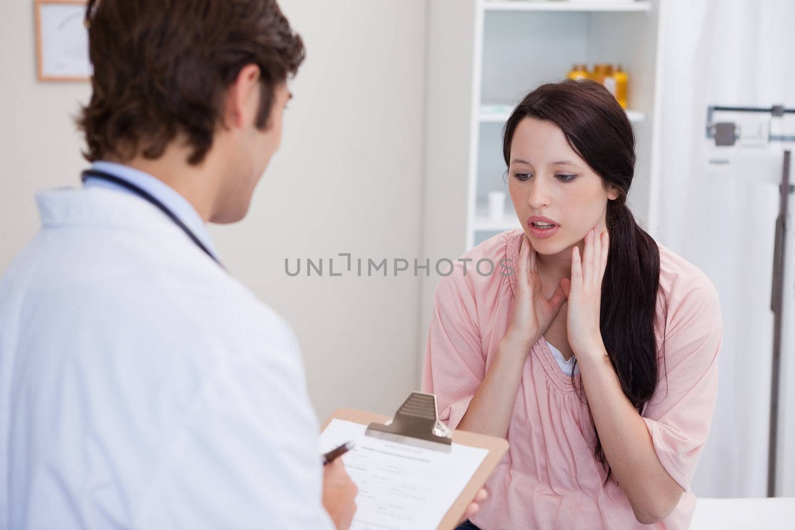 Male doctor having conversation with patient