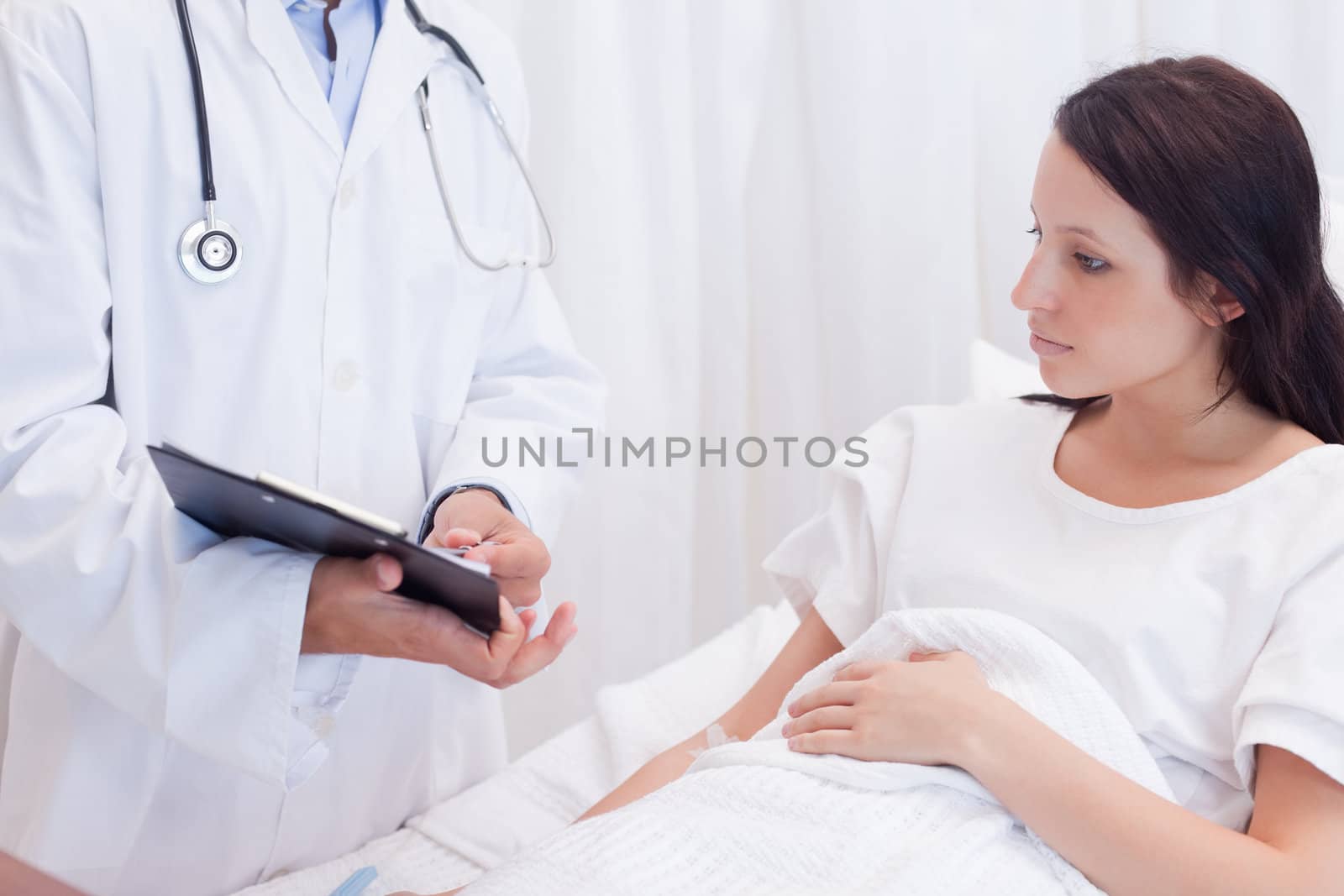 Female patient getting examination results explained