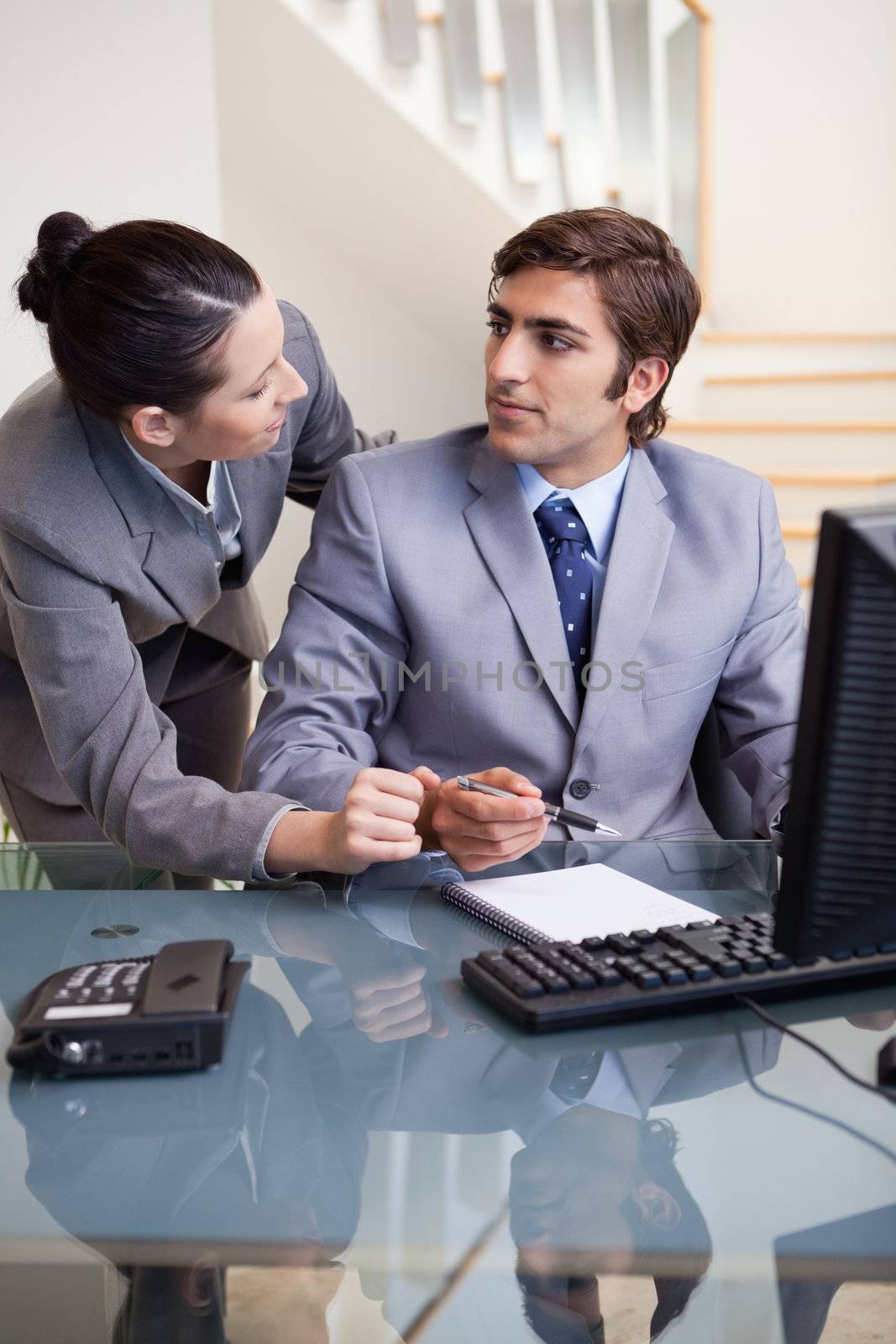 Businesswoman explaining something to her colleague by Wavebreakmedia